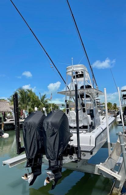Slide: The Image of 2023 Concept 27 boat with dual outboard motors docked at marina. - 9