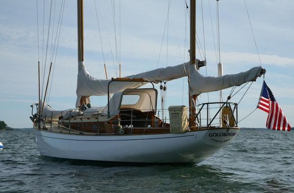 Slide: The Image of 1958 Concordia Yawl sailboat anchored with American flag. - 3