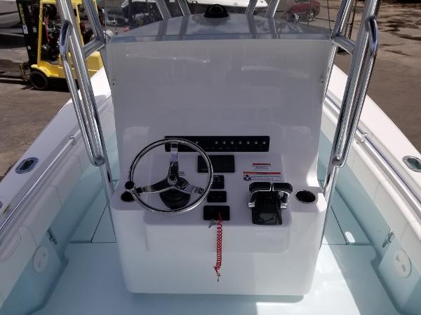 Slide: The Image of 2024 Contender 25 Tournament boat console with steering wheel and controls. - 8