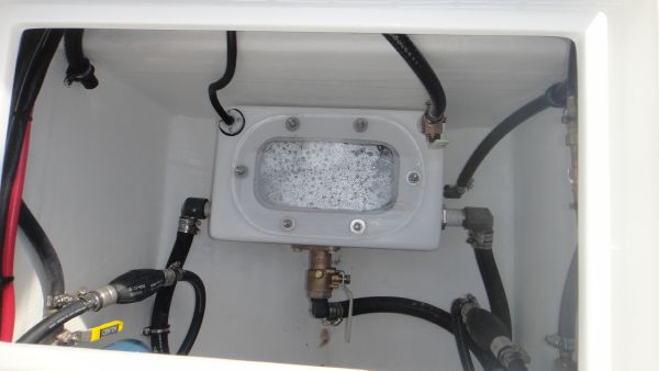 Slide: The Image of Contender 28T 2024 model boat bilge compartment with hoses and fittings. - 10