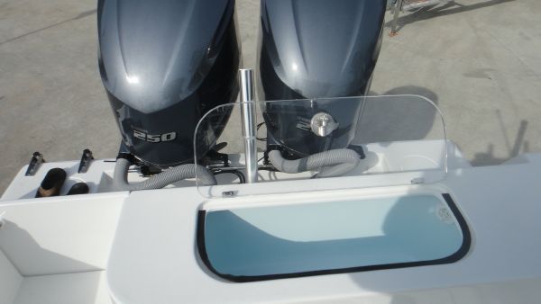 Slide: The Image of 2024 Contender 28T boat with dual 250 horsepower engines and livewell. - 11