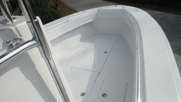 Slide: The Image of 2024 Contender 28T boat deck with storage compartments. - 14