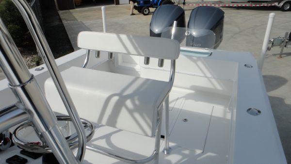 Slide: The Image of 2024 Contender 28T boat with dual outboard engines and white seating. - 16