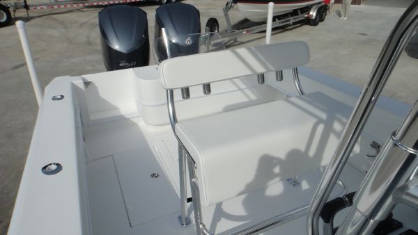 Slide: The Image of 2024 Contender 28T boat with dual outboard engines and white seating. - 17