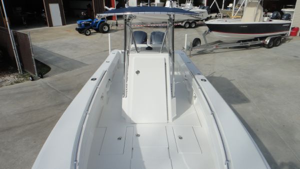 Slide: The Image of 2024 Contender 28T center console boat, docked in a marina. - 21
