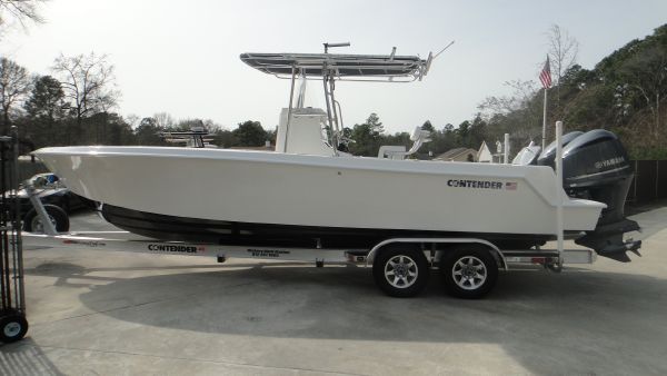 Slide: The Image of 2024 Contender 28T boat on trailer with dual Yamaha engines. - 4