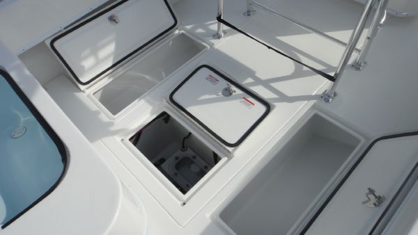 Slide: The Image of 2024 Contender 28T boat storage compartments and hatches. - 9
