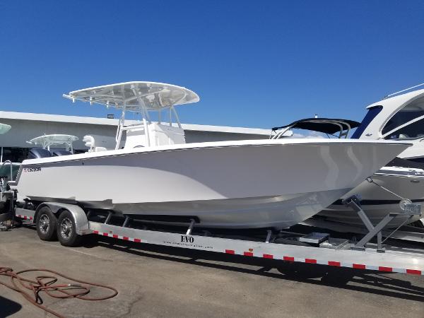 Slide: The Image of 2024 Contender 30 ST boat on a trailer in a marina. - 0