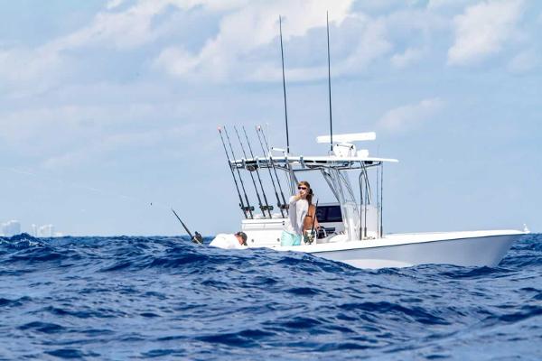 Slide: The Image of 2025 Contender 32 ST fishing boat on the ocean with a person fishing. - 17
