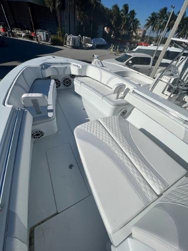 Slide: The Image of 2025 Contender 35 ST boat interior with white seating and modern design. - 11