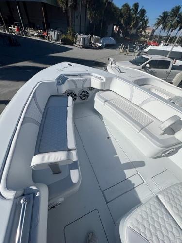 Slide: The Image of 2025 Contender 35 ST boat interior with white seating and modern design. - 12