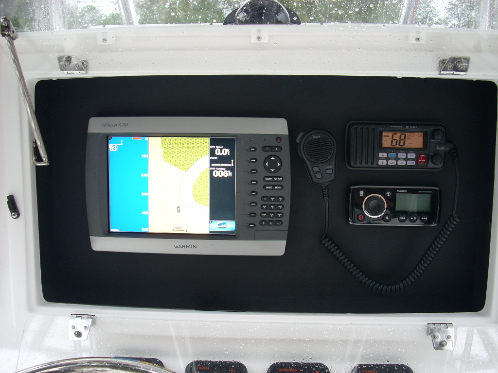 Slide: The Image of Garmin GPS and radio equipment on 2024 Contender 35 ST STEP HULL boat. - 12