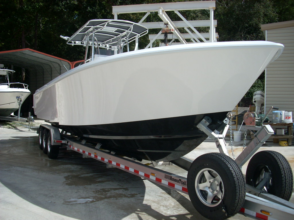 Slide: The Image of 2024 Contender 35 ST STEP HULL boat on trailer in storage area. - 2