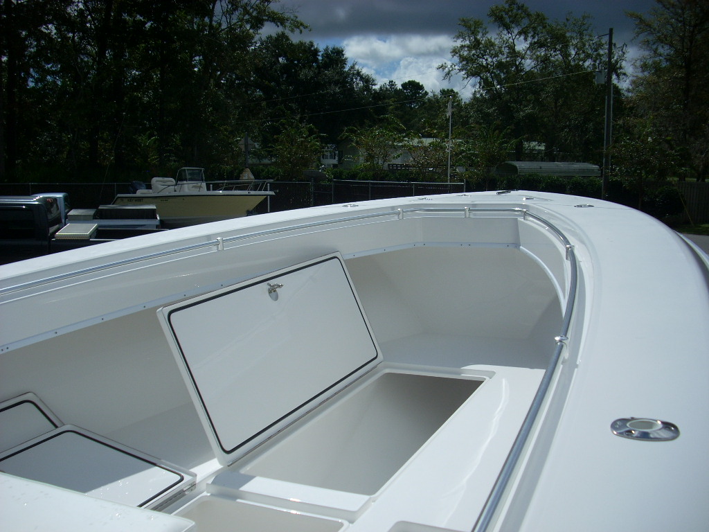 Slide: The Image of 2024 Contender 35 ST STEP HULL boat with open storage compartments. - 5