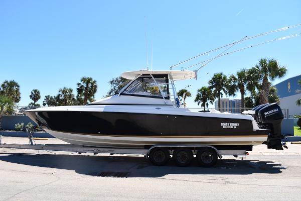 Slide: The Image of 2008 Contender 36 Fish Around boat on a trailer, side view. - 0