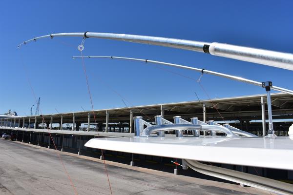 Slide: The Image of Fishing rods on a 2008 Contender 36 Fish Around boat at a marina. - 11