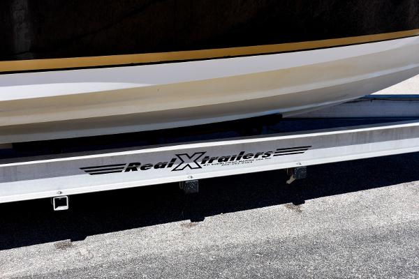 Slide: The Image of 2008 Contender 36 Fish Around boat on Real X Trailers trailer. - 13