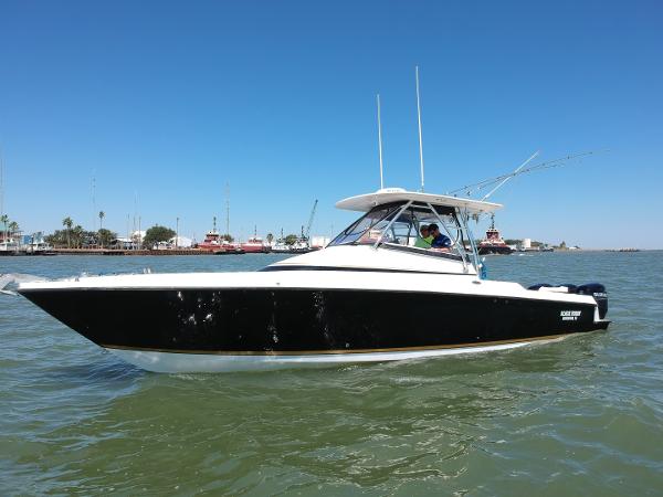 Slide: The Image of 2008 Contender 36 Fish Around boat on the water. - 16