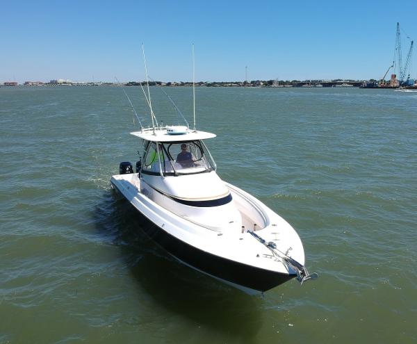 Slide: The Image of 2008 Contender 36 Fish Around boat cruising on open water. - 24