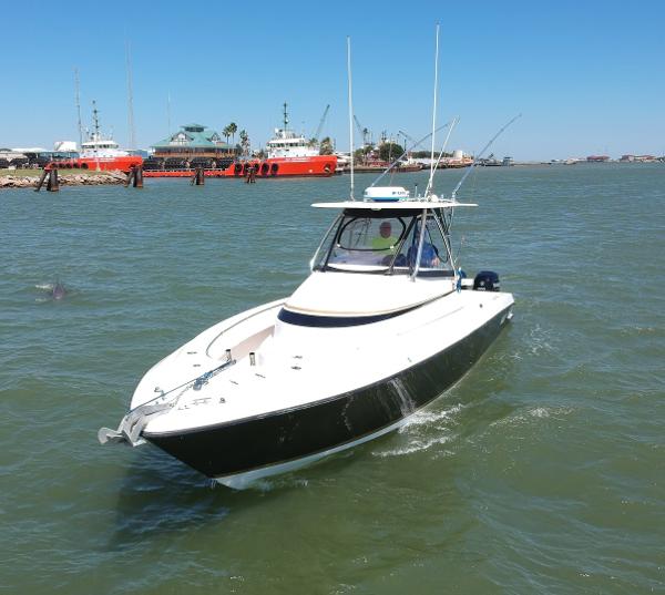 Slide: The Image of 2008 Contender 36 Fish Around boat cruising in a harbor. - 25