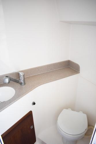 Slide: The Image of 2008 Contender 36 Fish Around boat bathroom with sink and toilet - 4