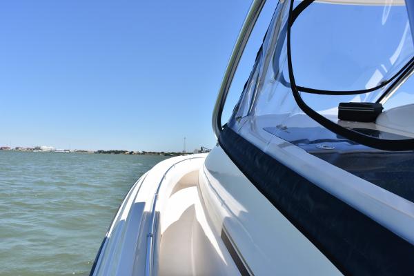 Slide: The Image of 2008 Contender 36 Fish Around boat on open water. - 6