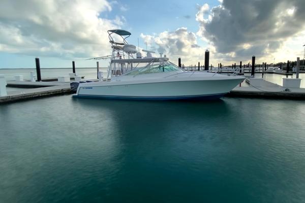Slide: The Image of 2008 Contender 38 Express boat docked in a marina. - 0