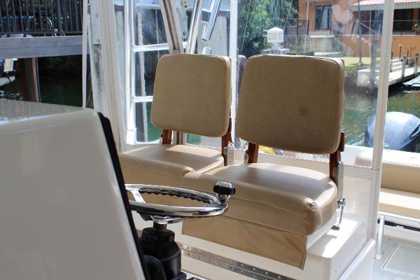 Slide: The Image of 2008 Contender 38 Express boat interior with dual beige captain seats. - 19