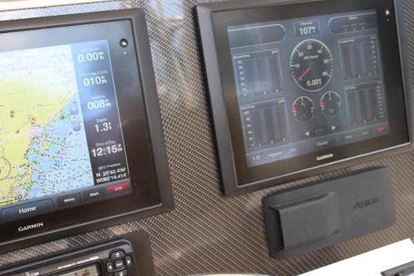 Slide: The Image of Garmin navigation and control screens on a 2008 Contender 38 Express boat. - 21