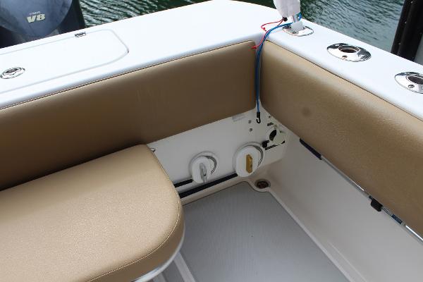 Slide: The Image of 2008 Contender 38 Express boat interior seating and fishing rod holders. - 25