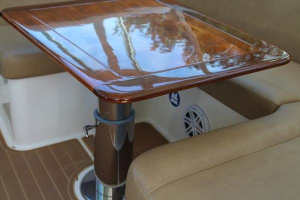 Slide: The Image of Polished wooden table in the seating area of a 2008 Contender 38 Express boat. - 32