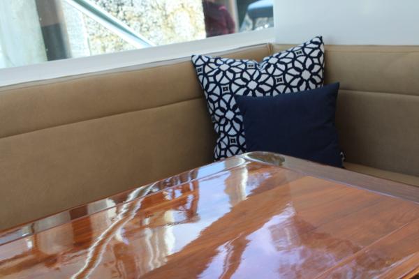 Slide: The Image of Interior seating area of a 2008 Contender 38 Express boat with decorative pillows. - 34
