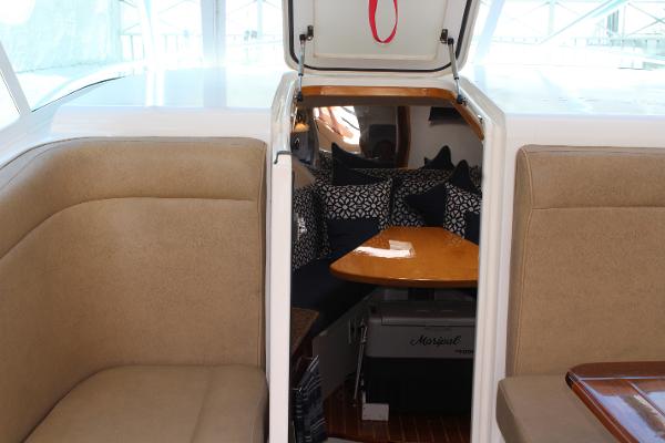 Slide: The Image of 2008 Contender 38 Express cabin interior with seating and table. - 35