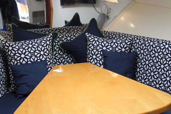 Slide: The Image of Interior seating area of a 2008 Contender 38 Express boat with patterned cushions. - 37