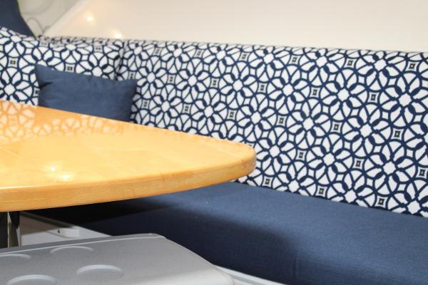 Slide: The Image of Interior seating area of a 2008 Contender 38 Express boat with patterned upholstery. - 38