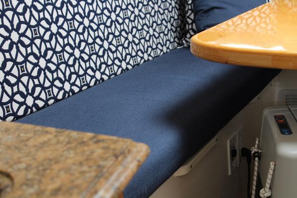 Slide: The Image of Interior seating of 2008 Contender 38 Express boat with patterned backrest and blue cushion. - 39