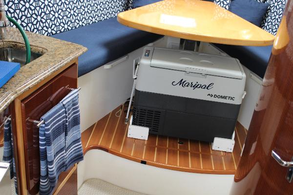 Slide: The Image of 2008 Contender 38 Express cabin interior with Dometic cooler and kitchenette. - 46