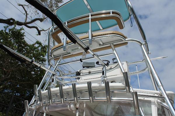 Slide: The Image of 2008 Contender 38 Express boat with upper deck and rod holders. - 9