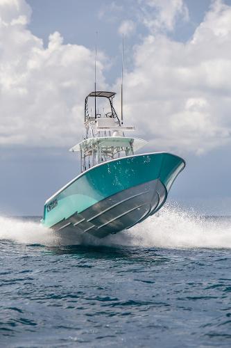 Slide: The Image of 2024 Contender 39 ST boat cruising on open water. - 1