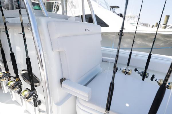 Slide: The Image of 2024 Contender 39 ST boat with fishing rods and white seating. - 11