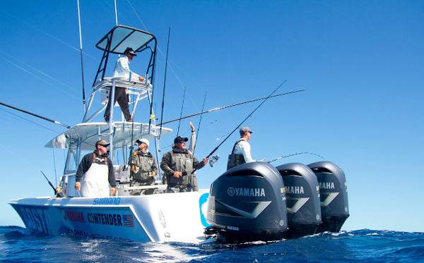 Slide: The Image of 2024 Contender 39 ST fishing boat with Yamaha engines and anglers on board. - 4