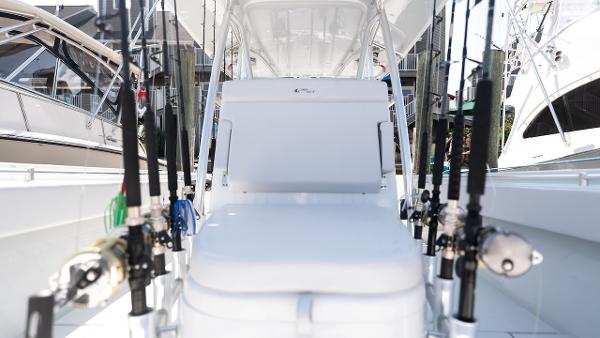 Slide: The Image of 2024 Contender 39 ST fishing boat with multiple fishing rods. - 5