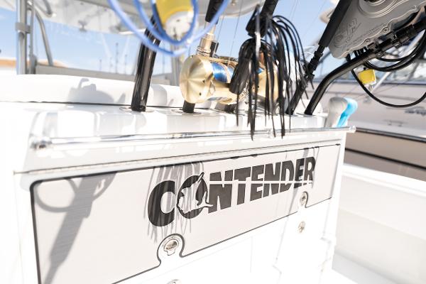 Slide: The Image of 2024 Contender 39 ST fishing boat with rod holders and equipment. - 6