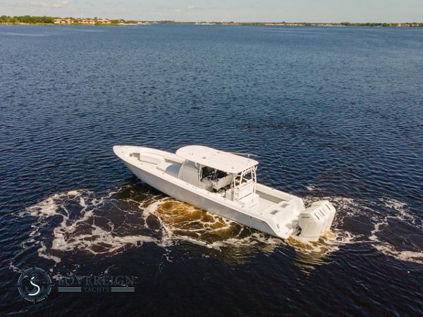 Slide: The Image of 2024 Contender 44 CB boat cruising on open water. - 0
