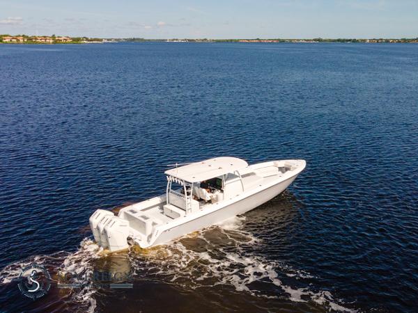 Slide: The Image of 2024 Contender 44 CB boat cruising on open water. - 1