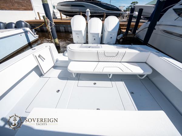 Slide: The Image of 2024 Contender 44 CB yacht deck with triple outboard engines. - 12