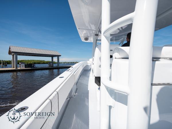 Slide: The Image of 2024 Contender 44 CB yacht docked at a marina, Sovereign Yachts logo visible. - 17
