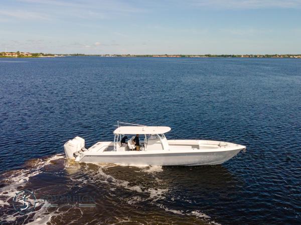 Slide: The Image of 2024 Contender 44 CB boat cruising on open water. - 2