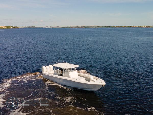 Slide: The Image of 2024 Contender 44 CB boat cruising on open water. - 3