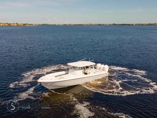 Slide: The Image of 2024 Contender 44 CB boat cruising on open water. - 5